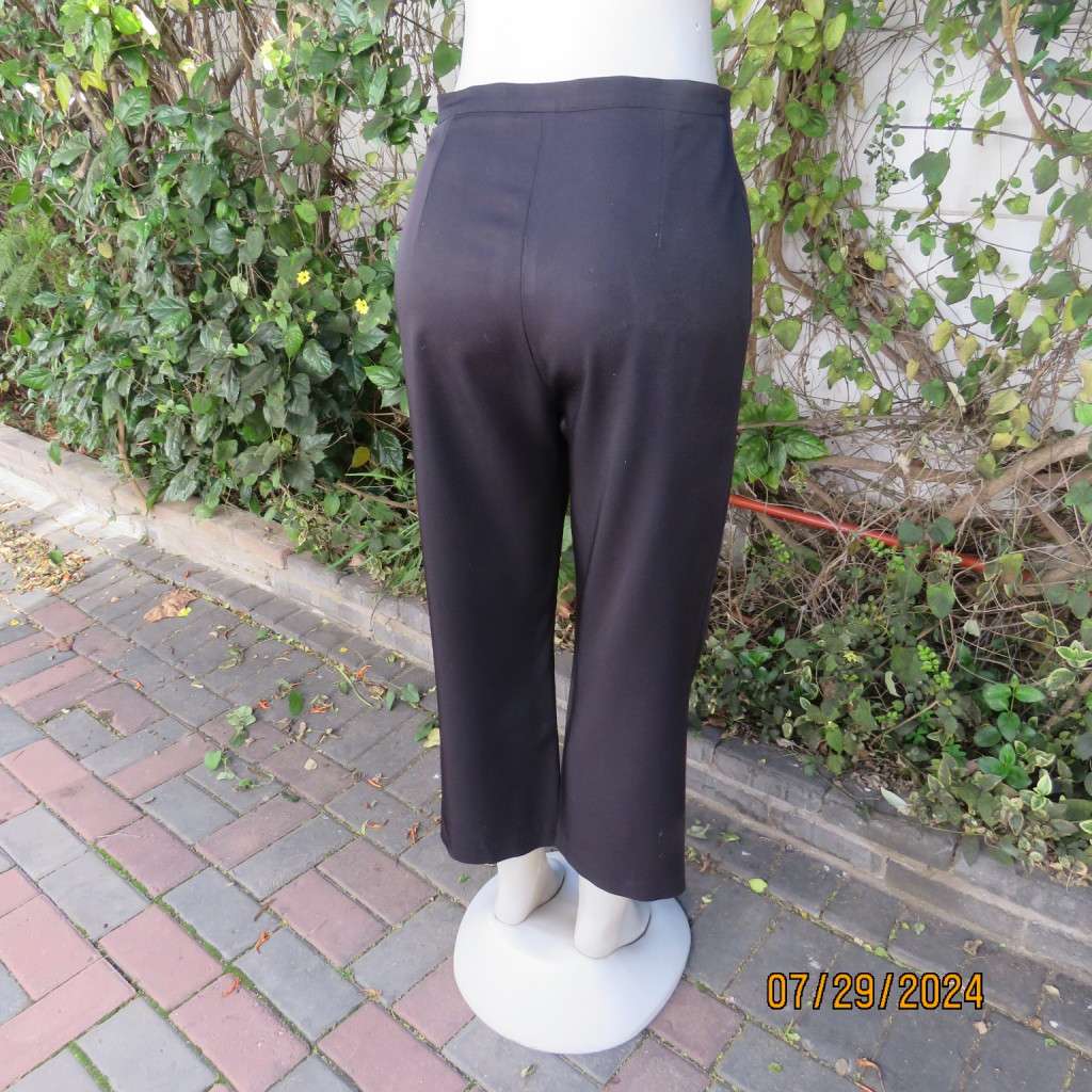 Black silky,shiny stretch polyester ankle length pants by MERIEN HALL size 35. Very good condition