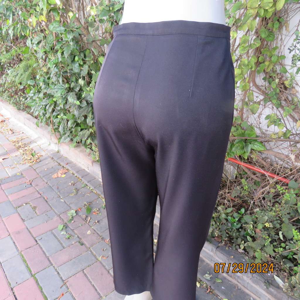Black silky,shiny stretch polyester ankle length pants by MERIEN HALL size 35. Very good condition