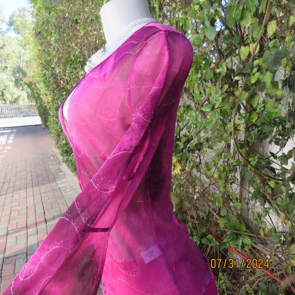 Sexy sheer stretch polyester slip over size 32 top in magenta pinks.Front peephole. As new.