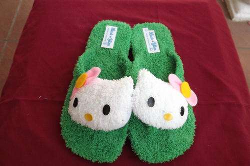 Pair of Green Hello Kitty Flip Flop Character Slippers in size 5
