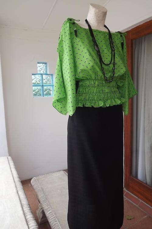 Lime Green with small black design Top in 40% Silk & 60% Polyester-size 12/36 by Madam Posh-as new