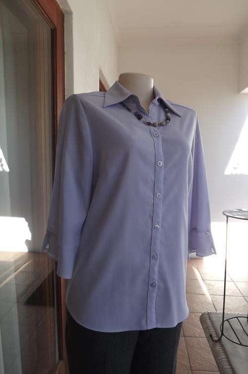 As New Lavender Colour Blouse in size 12/36 - 3 quarter sleeves with flair cuffs - button down front