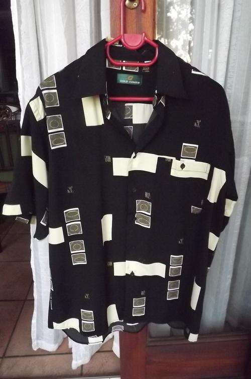 Black 100% polyester short sleeve  shirt with yellow/beige block patterns.By Gold Humen.Size 39/40