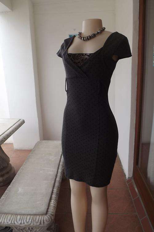 Grey bodyhugging polkadot dress by Legit in size 32/8.Poly/Viscose blend with spandex.Crossover bodi