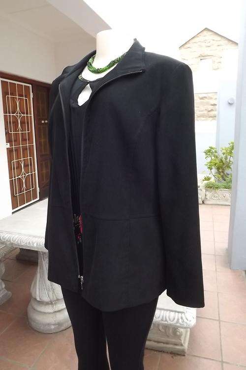 Warm black lined Woolworths jacket with zipped front.Size 38/14.Polyester stretch fabric.As new cond