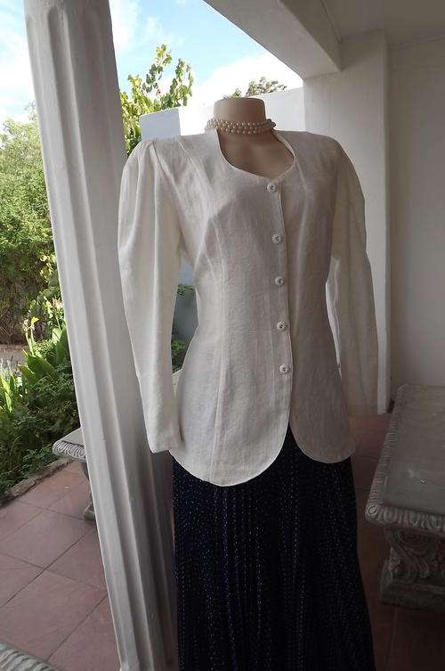 Beautiful cream colour brocade jacket.Size 36/12 with leg o' mutton sleeves and horseshoe neckline.