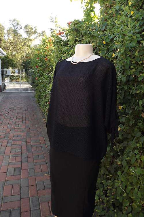 Stunning black batwing sheer top by Raoul in size 38/14.Suitable for day/evening.Boat neck.