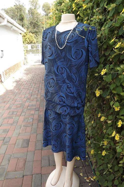 Fabulous royal blue and black geometrically patterned fold over dress by Nina size 42/18.Extended mi