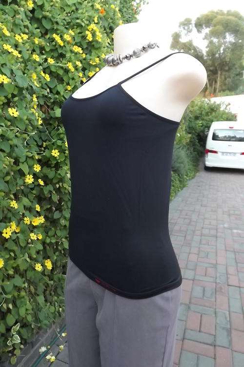 Black nylon stretch strappy top with build in bra by Skinny size Large.As new condition