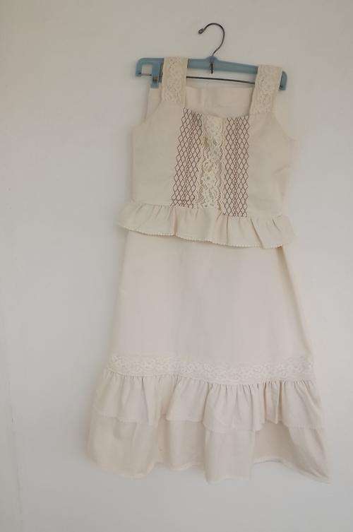 Beige 2 piece girls dress by Little number.Size 28/4.Long frilled skirt and top in 100% cotton.