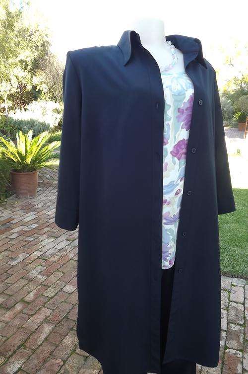 Versatile navy size 40/16 silky polyester coat with three quarter sleeves by Nada.Shirt style.Button