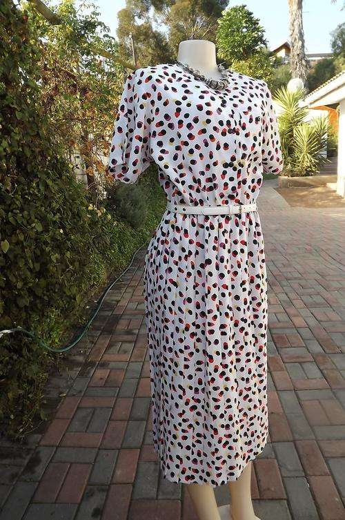 White silky polkadot dress in size 32/8 by Foshini.Black dots with red,pink and yellow.Rounded neck