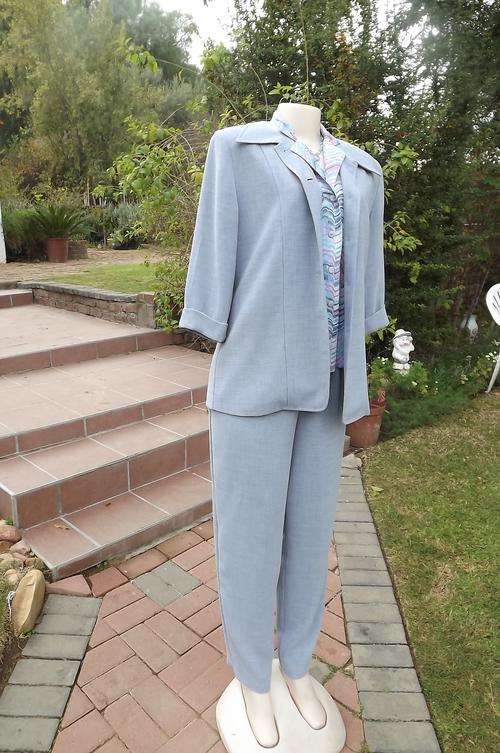 Beautiful Light Blue Caviar Pant Suit. Jacket size 34/ Pants 36 for comfortable fit.New condition.