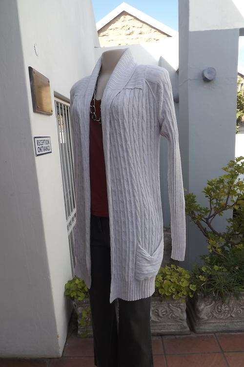 Light weight free falling long beige knitted cardigan in size 32/8 by Cherokee California.Good cond