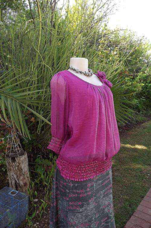 Pretty mexican pink sheer polyester top with lining by Cool Ice size 36/12.Blouson style