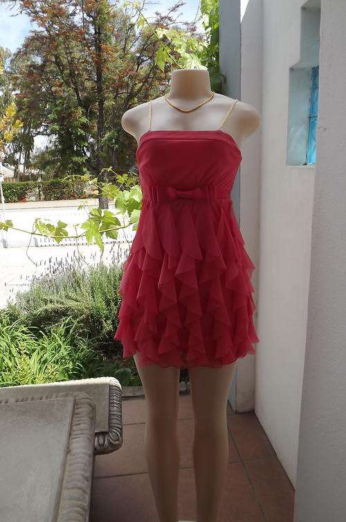 Feminine frilled coral mini dress by Identity size 30/6.Lining in stretch polyester with sheer top