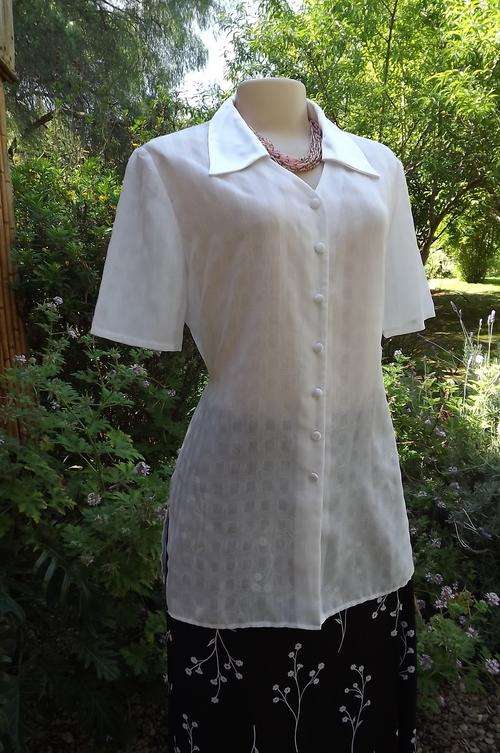 Smart white sheer polyester blouse by Truworths size 36/12.Satin collar and button covers.