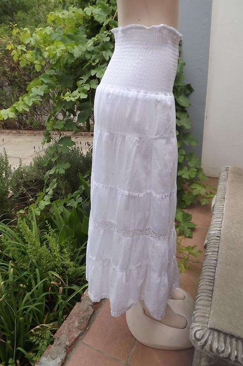 Bright white cotton tiered skirt with wide elasticated middle.Size 36/12.Good condition