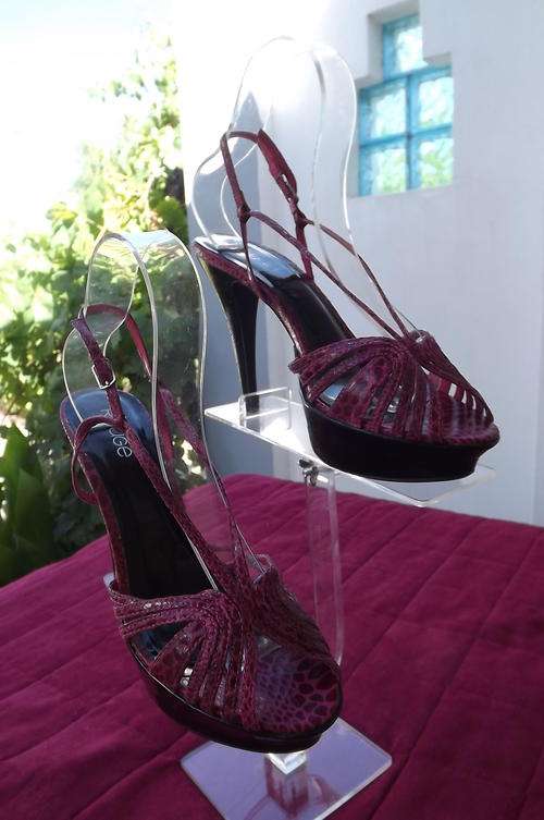 Pair of Crimson faux snakeskin high heel ankle strap shoes by Rouge size 6. Good condition.
