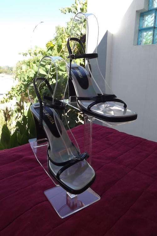 Pair of black high heel sandals with ankle straps size 4 by Vice Versa. Used but in good conditio