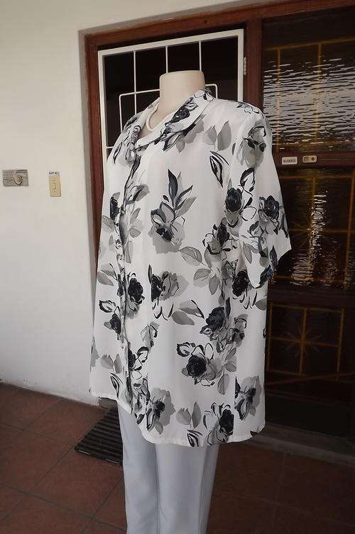 White wash + wear polyester blouse with grey and steelblue bold floral pattern.Good condition.
