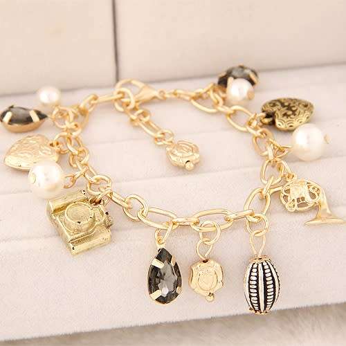 Stunning gold plated charm bracelet!! with 6 free charms
