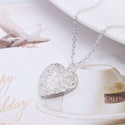 Filigree heart locket. and free chain. LOWEST SHIPPING