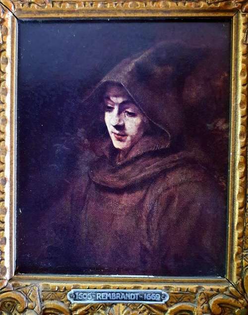 ANTIQUE PRINT OF REMBRANDT IN HEAVY SOLID ORNATE WOOD FRAME.