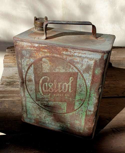 ANTIQUE EMBOSSED CASTROL MOTOR OIL 2 GALLON CAN. ORIGINAL BRASS LID.