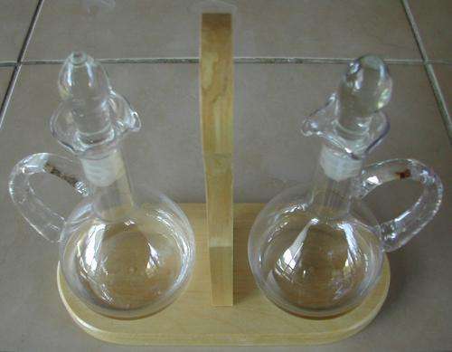 OLIVE OIL AND VINEGAR BOTTLES ON STAND. 12 X AVAILABLE.
