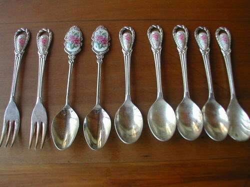 NINE VINTAGE MIX LOT OF SPOONS AND FORKS.  PORCELAIN INLAY!!