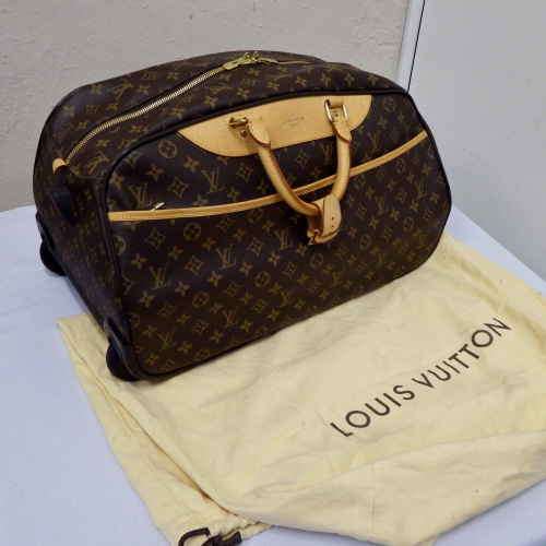 Authentic Louis Vuitton rolling/carry travel bag with original material bag for protection - As New
