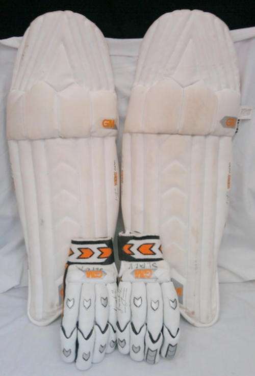 CRICKET PADS AND GLOVES VERY WELL USED