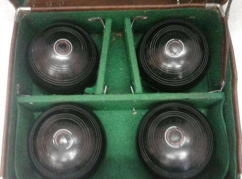 SET OF FOUR BOWLING BALLS IN CASE SIZE OF BALLS ARE  4 7/8