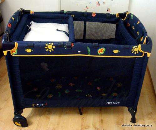 Baby Camp Cot With nappy changing, storage with mosquito net and bag