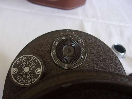 Vintage Bell & Howell "Filmo" 70 movie camera in leather case