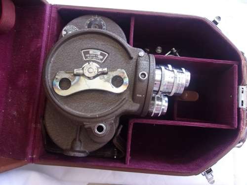 Vintage Bell & Howell "Filmo" 70 movie camera in leather case
