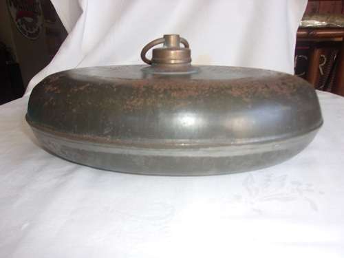 Antique oval metal and pewter hot water bottle/ foot warmer with brass lid