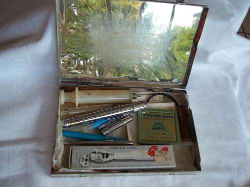 Vintage doctors silver box with medical instruments