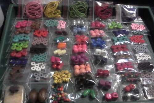 65pkts of assorted wood beads(6,8,10 mm).and wax cord(1mt lenght)pls see photo for what you will get