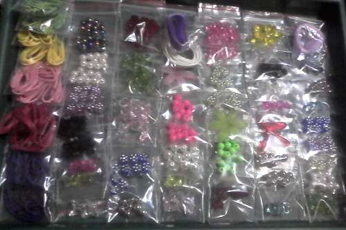 65 pkts of assorted acrylic beads and goodies & wax cord..see photo