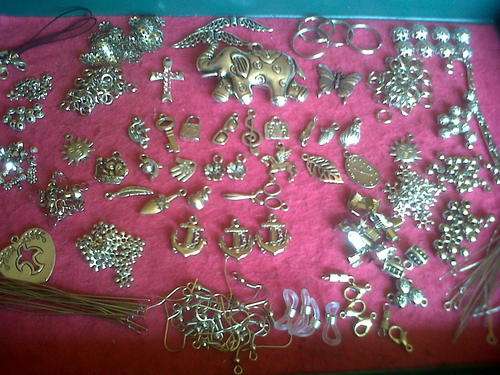 Metal mix with pendants,charms, etc(Bid on 40pkts for whole mix)