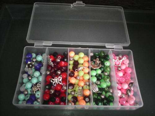 container with assorted glass beads(250)included 10 charms,25 filligree beads