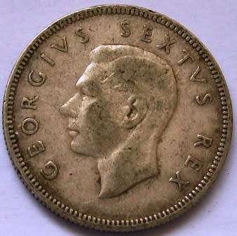 1949  Two shillings Please see photos below. 80% Silver -Circulated coin.