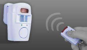 Wireless Motion Sensor Alarm and Chime Kit with two remote controls and wall mountings