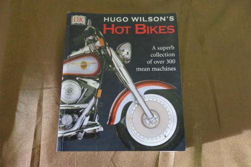 A FANTASTIC 480 PAGE ILLUSTRATED REFERENCE BOOK TITLED "HOT BIKES" BY HUGO WILSON