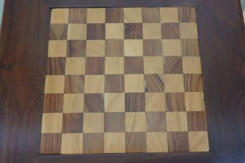A BEAUTIFULLY MADE VINTAGE SOLID TEAK PEDESTAL CHESS BOARD WITH TEAK AND YELLOW WOOD INLAY SQUARES