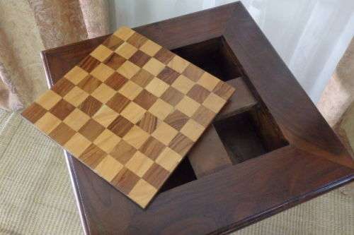 A BEAUTIFULLY MADE VINTAGE SOLID TEAK PEDESTAL CHESS BOARD WITH TEAK AND YELLOW WOOD INLAY SQUARES