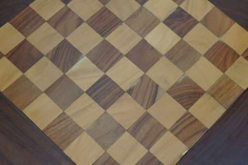 A BEAUTIFULLY MADE VINTAGE SOLID TEAK PEDESTAL CHESS BOARD WITH TEAK AND YELLOW WOOD INLAY SQUARES