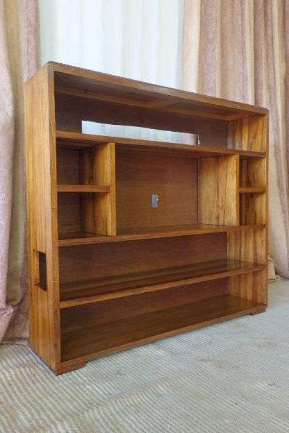 A BEAUTIFUL AND SOLIDLY MADE ORIENTAL TEAK BOOK CASE WITH AMPLE SHELVES AND STORAGE PIGEON HOLES